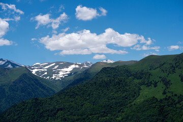 Snow-capped mountains and lush green valleys