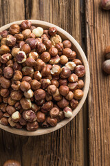 Full and peeled hazelnuts close-up. Macro photo of pile of filbert kernels