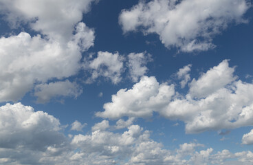 Sky replacement blue fluffy clouds over horizon against vivid blue sky 1