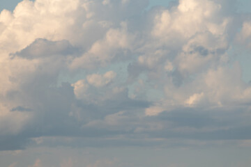 Sky replacement, puffy, hazy clouds against aqua sky