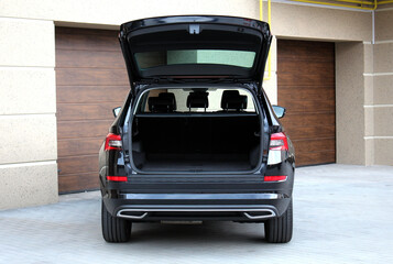 Parked car with an open trunk. Modern car with open empty trunk. Modern wagon car open trunk. Car boot is open. © Best Auto Photo
