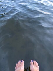 Bare feet over water