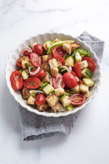 Tuscan Panzanella, traditional Italian salad with tomatoes and bread. Vegetarian panzanella salad. Mediterranean healthy food.