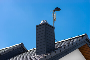 Antenna amplifier for home mobile Internet and a TV receiver mounted on the chimney.