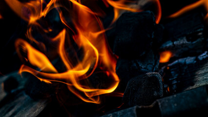 Dynamic Flames and Charcoal Glow A captivating depiction of heat and motion in nature