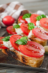 Italian Bruschetta on Ciabatta: Fresh Tomatoes, Garlic, and Olive Oil on a Wooden Table, Rustic