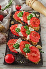 Italian Bruschetta on Ciabatta: Fresh Tomatoes, Garlic, and Olive Oil on a Wooden Table, Rustic