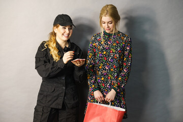 Security guard and blonde girl .