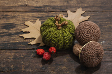 Autumn cozy mood composition. Crocheted pumpkins, handmade, fall hobby concept