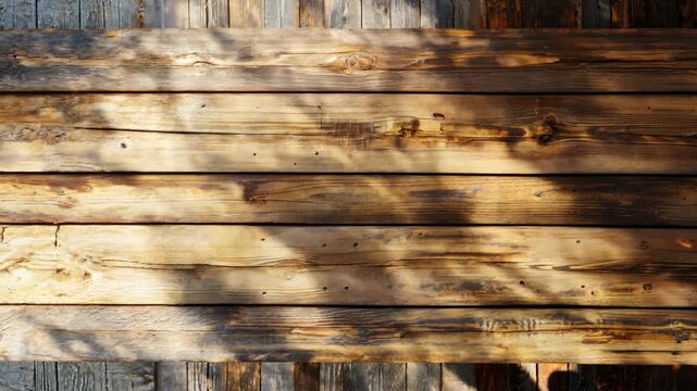 A close-up of wooden boards showing signs of age and use, including peeling paint and gaps between the planks.