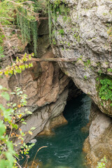 A stormy mountain river flowing in a narrow rocky gorge