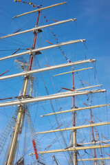 Tall ship masts against the sky.