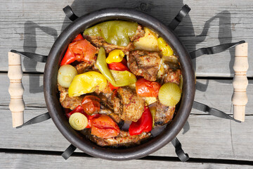 Traditional Balkan dish. Sac. baked meat with vegetables