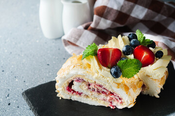 Delicate Meringue Roulade with Blueberries, Strawberries, and Mascarpone Cream