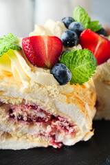 Delicate Meringue Roulade with Blueberries, Strawberries, and Mascarpone Cream