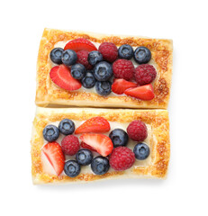 Tasty puff pastries with berries isolated on white, top view