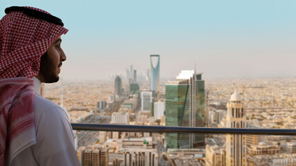 Saudi Man Looking at Riyadh Landscape at daylight