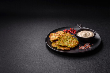 Vegetable zucchini fritters with garlic, salt, spices and herbs