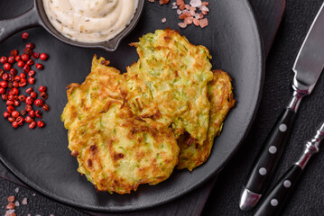 Vegetable zucchini fritters with garlic, salt, spices and herbs