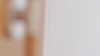 A man activates his home security system, ensuring safety before stepping out into the world.