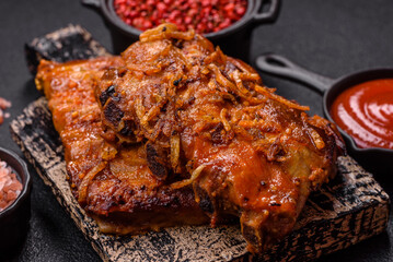 Delicious juicy grilled ribs with honey and mustard sauce with salt, spices and herbs