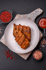 Delicious juicy grilled ribs with honey and mustard sauce with salt, spices and herbs