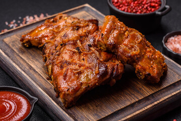 Delicious juicy grilled ribs with honey and mustard sauce with salt, spices and herbs