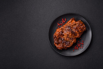 Fresh juicy delicious beef steak on a dark background