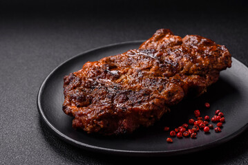 Fresh juicy delicious beef steak on a dark background