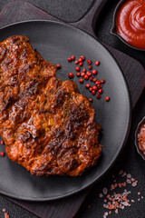Fresh juicy delicious beef steak on a dark background