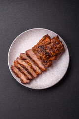 Fresh juicy delicious beef steak on a dark background