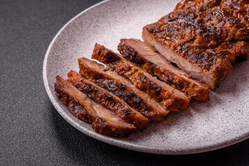 Fresh juicy delicious beef steak on a dark background
