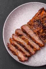 Fresh juicy delicious beef steak on a dark background