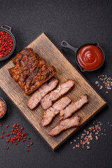 Fresh juicy delicious beef steak on a dark background