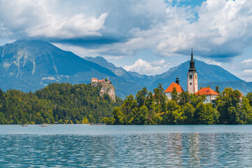 The famous and beautiful lake Bled with it’s signature small Bled Island with in the background Bled Castle on the high cliff, Bled, Slovenia