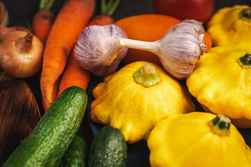 Assorted various vegetables and mushrooms on the table. Autumn harvest.