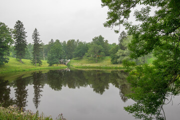 A lake with a few trees in the background