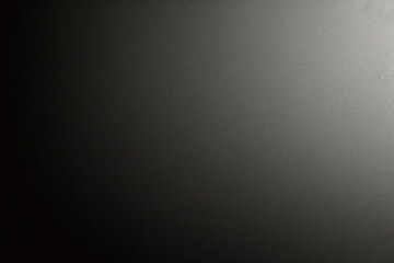 Black foil gradient texture background with uneven surface