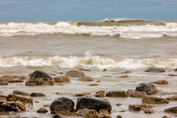 Oncoming waves of Lake Michigan strike the rocky shoreline of Harrington Beach State Park, Belgium, Wisconsin in late October.  