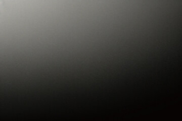 Black foil gradient texture background with uneven surface