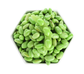 Raw green edamame soybeans in bowl isolated on white, top view