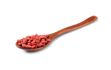 Dried goji berries and spoon isolated on white