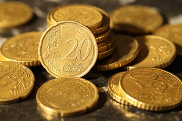 Many euro coins on dark table, closeup