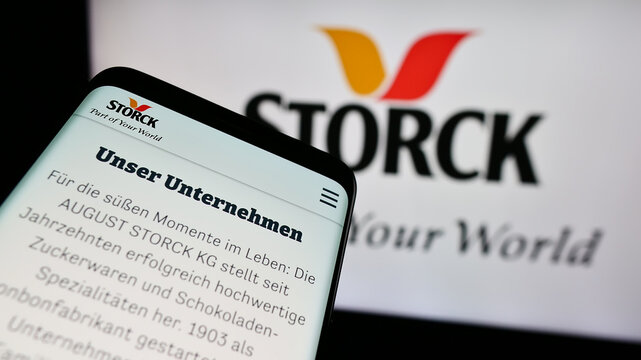 Stuttgart, Germany - 08-07-2024: Mobile phone with website of German confectionery company August Storck KG in front of business logo. Focus on top-left of phone display.