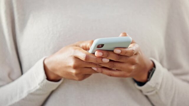 Person holding a phone while texting on social media. One trendy woman writing a quick and convenient text message on an instant chat app. Closeup of a girl browsing content online or on the internet