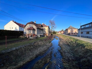 Olesná river flowing through the center of Palkovice village