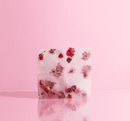 pink ice cubes with dried roses inside