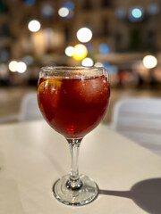 Cold colorful red sangria on a summer day night in street restaurant.
