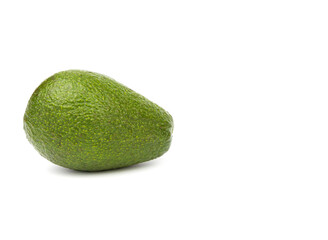 A whole fresh green avocado.