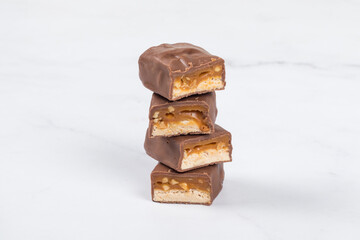Fitness Candy bar with nougat, caramel, peanuts and hazelnuts. In milk chocolate